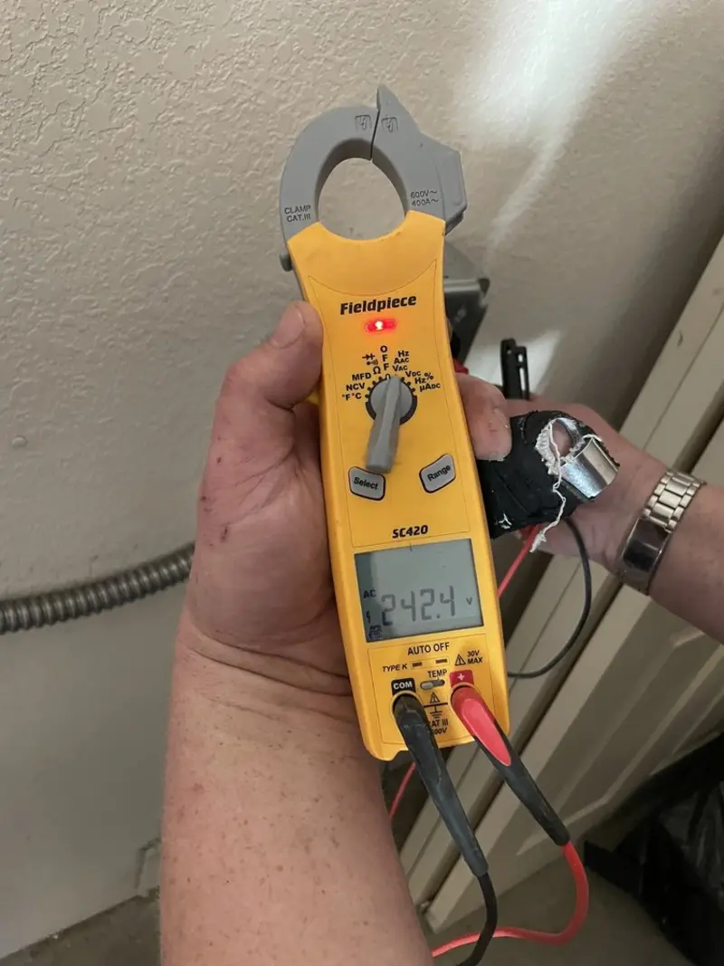 Voltage testing with clamp meter during Electrical Installation Services in Holden Lakes